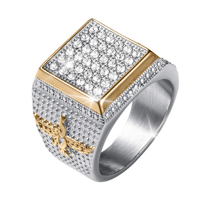 Two tone ring with a square top covered in clear faceted stones and a textured silver band accented by gold tone detailing and side stones