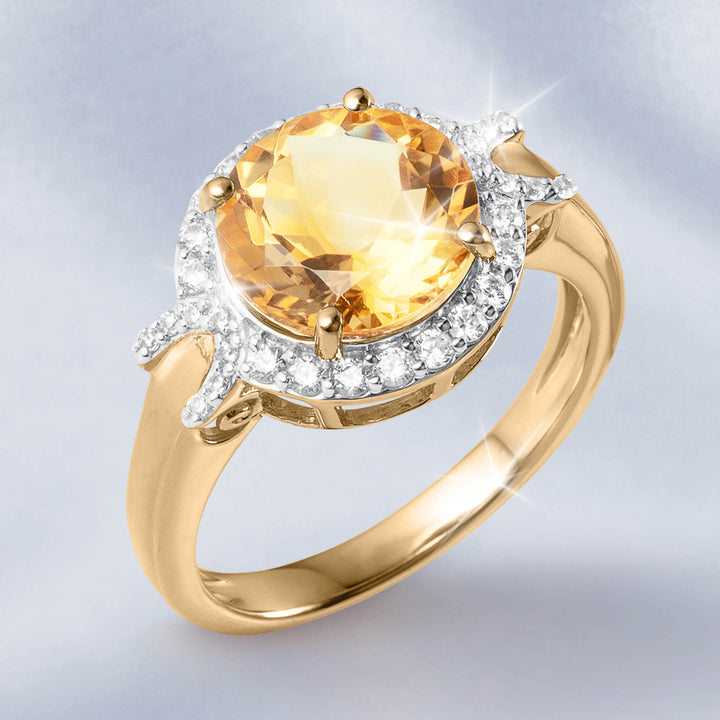 Golden Glow Collection gold ring with a large faceted golden gemstone surrounded by sparkling clear stones and a polished band Up To 75% Off Retail