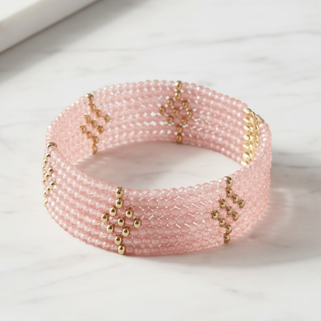 Rosa Cascade Bracelet featuring delicate pink gem beads accented with rose gold plating, designed as an elegant female jewelry piece perfect for sophisticated style.