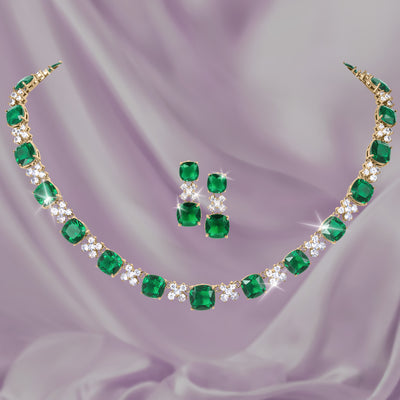 Freya Collection emerald green gemstone necklace and matching earrings displayed on lavender fabric Up To 75% Off Retail