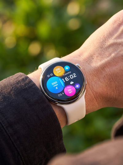 Pace Unisex Smart Watch worn on a wrist with a round color display and white band for connected everyday style Up To 75% Off Retail