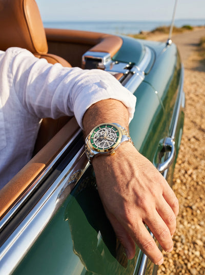 Heritage Skeleton Automatic Watch worn on a drivers wrist in a classic green convertible beside a sunny coastal road Up To 75% Off Retail