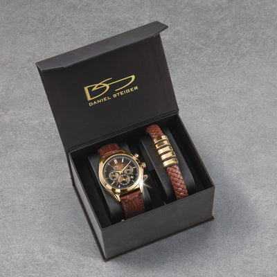Vicerory Watch & Bracelet Box Set featuring a gold tone chronograph watch and braided bracelet in a black Daniel Steiger case Up To 75% Off Retail