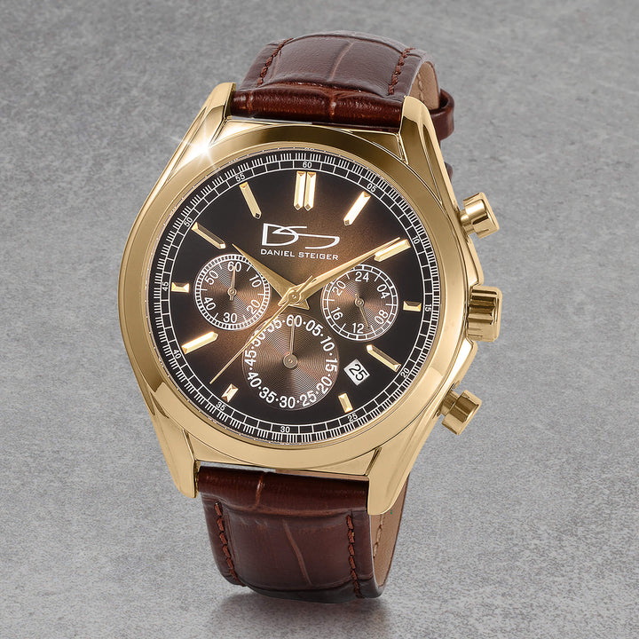 Vicerory Watch & Bracelet Box Set featuring a gold tone chronograph watch with black dial, luminous markers, subdials, date window, and brown leather strap