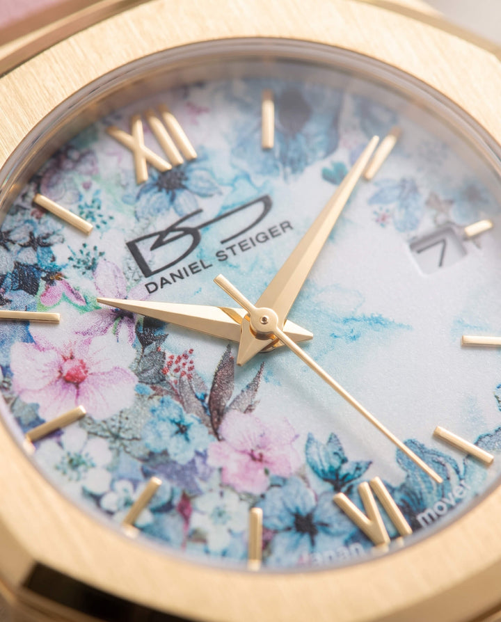Fleur De Vie Ladies Watch with floral blue and pink dial gold tone case Roman numerals and date window Up To 75% Off Retail