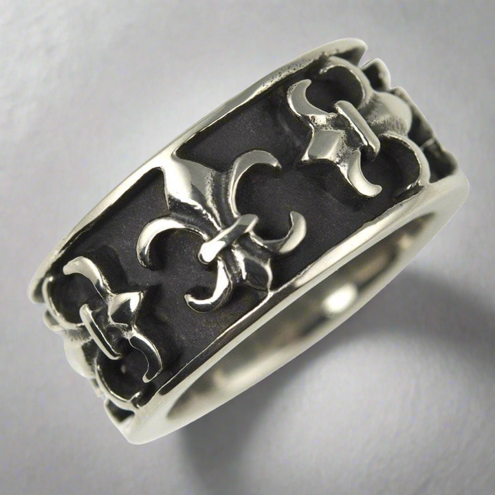 Fiorino Steel Ring for men crafted from stainless steel featuring an intricate raised pattern on a dark textured background, offering a bold and stylish jewelry piece.
