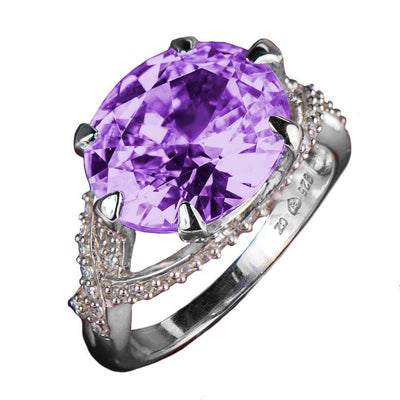 Flawless Thorn Rhodium Ring featuring a large oval purple gemstone set in sterling silver with intricate bead detailing, designed for female jewelry collectors.