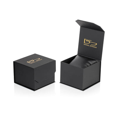Black and gold Daniel Steiger branded watch box with cushion, designed for packaging the Patriot Men's Watch, ideal for presenting collectible timepieces.