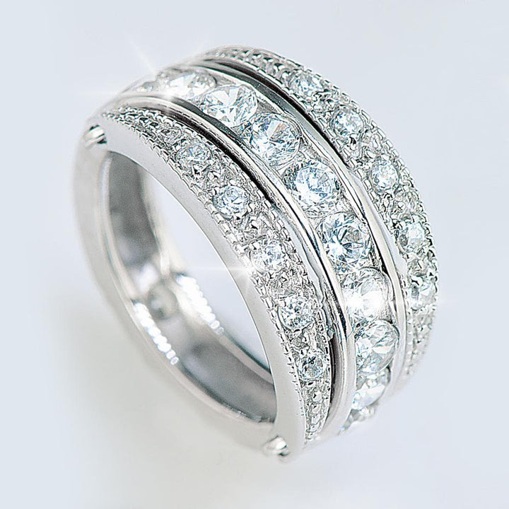 Swing Ring crafted from sterling silver featuring multiple rows of sparkling clear gemstones, designed for a sophisticated female jewelry collection.