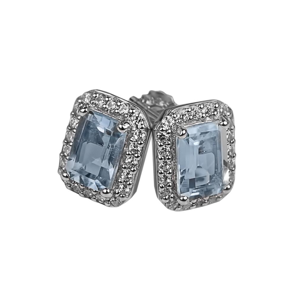 Destiny Topaz Earrings featuring light blue topaz stones set in rhodium-plated sterling silver with a sparkling halo design, elegant jewelry for women.