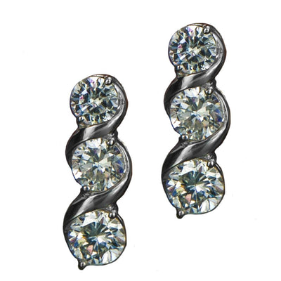 Sterling silver Solitaire Twist Earrings plated in rhodium featuring three sparkling round stones in a twisted design, elegant jewelry for women.