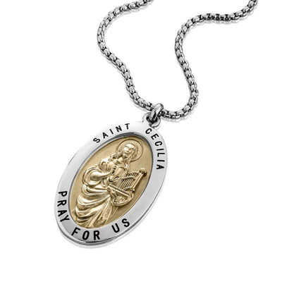 St Cecilia Pendant featuring a two-tone stainless steel design with an engraved image of Saint Cecilia holding a harp and the inscription "Saint Cecilia Pray For Us" on a unisex necklace.