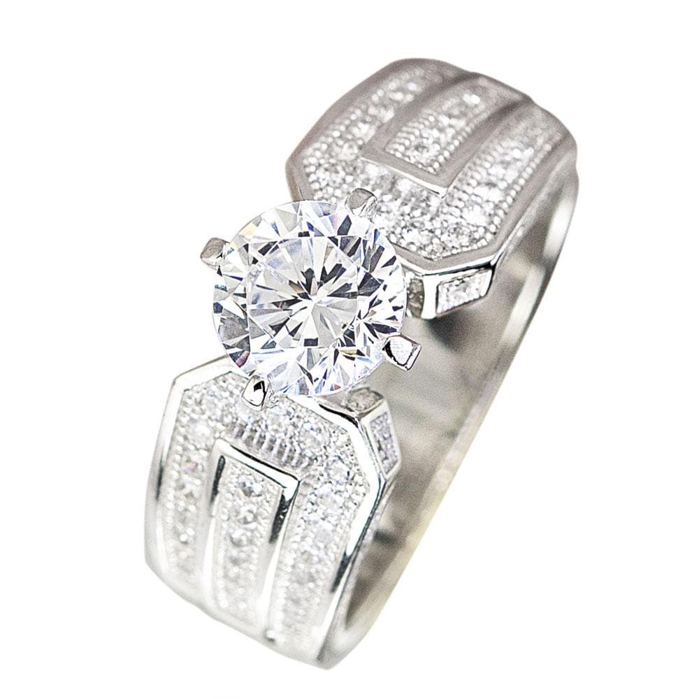 5th Avenue Rhodium Ring featuring a sterling silver band with intricate detailing and a large round clear gemstone centerpiece designed for women’s jewelry.