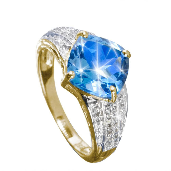 Luxe Swiss Topaz Ring featuring a radiant blue Swiss topaz gemstone set in sterling silver with gold plating, designed for a sophisticated female jewelry collection.