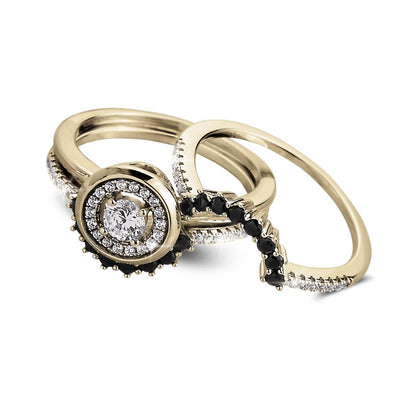 Trio Halo Ring set in sterling silver with gold plating, featuring a round center stone surrounded by a halo of smaller clear and black stones, designed for women’s jewelry.