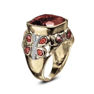 Springtime Garnet Ring featuring a gold-plated stainless steel band with a large garnet centerpiece and butterfly-shaped garnet accents, designed for women’s jewelry.