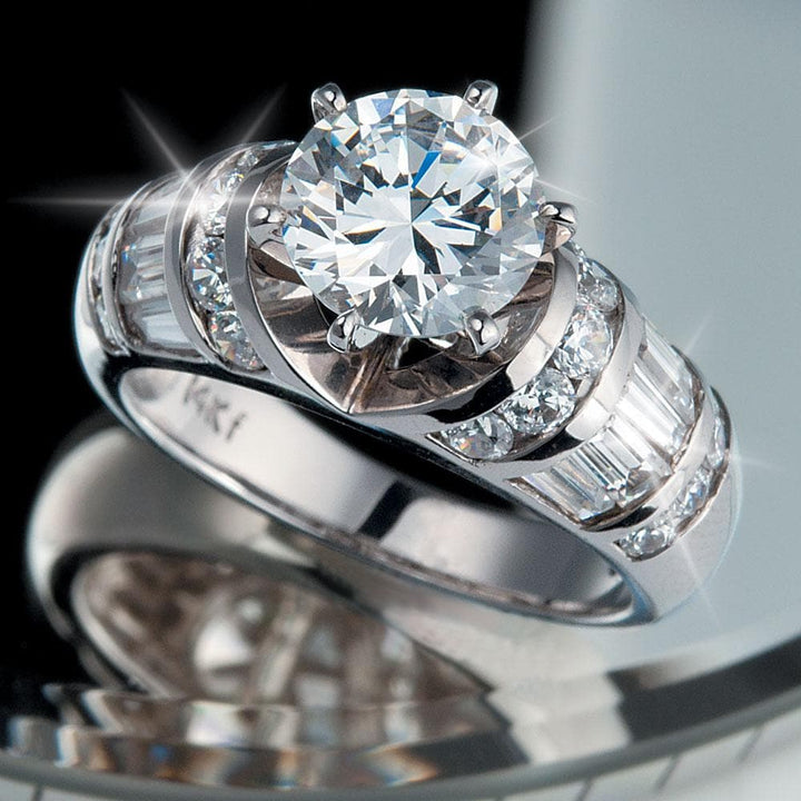 Sterling silver To Catch A Thief Ring for female featuring a large central round-cut stone with surrounding smaller rectangular and round stones in an elegant design.