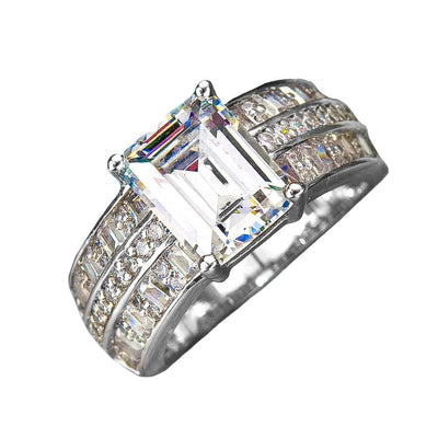 Aldelphi Ring featuring a large emerald-cut clear stone set in sterling silver with rhodium plating, designed for women’s fine jewelry and rings.