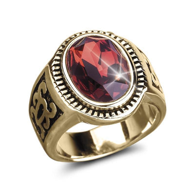 Odessa Red Men's Ring featuring a gold-plated stainless steel band with an ornate design and a large faceted red gemstone centerpiece, a bold men's jewelry piece.
