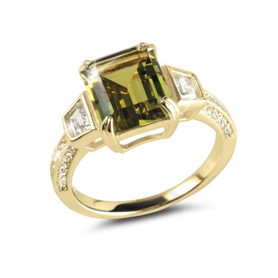 Lucia Ring featuring a gold-plated sterling silver band with a large rectangular green gemstone centerpiece, accented by smaller clear stones on each side, designed for women.