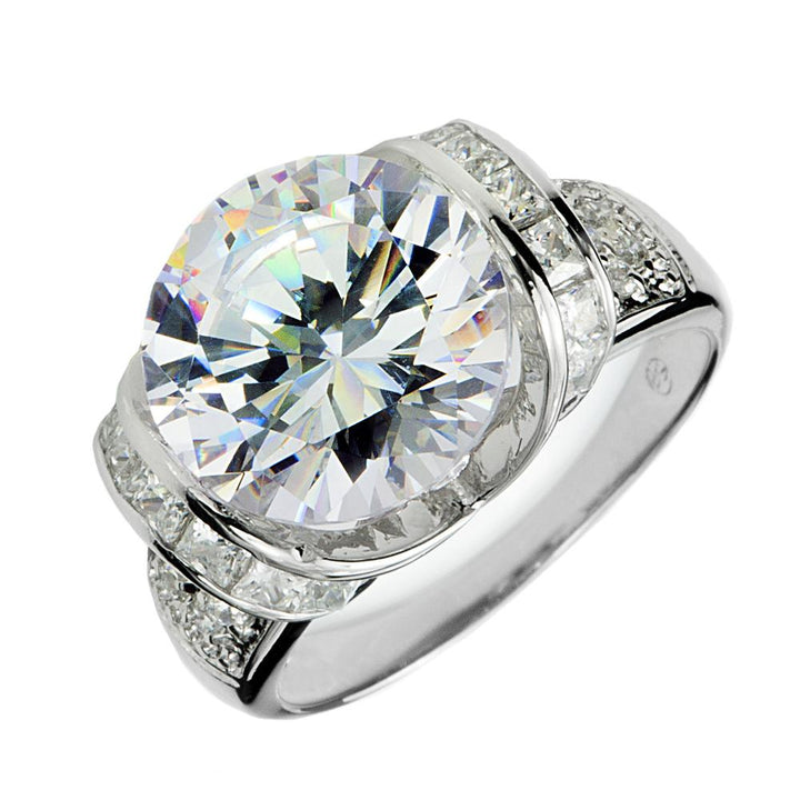 Ultima Ring featuring a large round center stone with smaller stones set in a sterling silver band plated in rhodium, designed for women’s fine jewelry.
