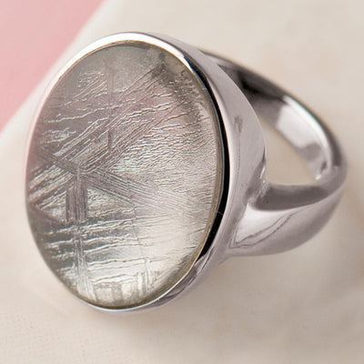 Sterling Silver Meteorite Ring for women featuring a polished band and a distinctive patterned meteorite stone centerpiece with natural texture.