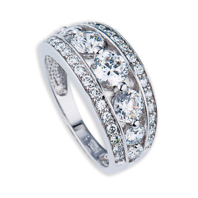 Martini Ring featuring a sterling silver band adorned with three large sparkling stones flanked by rows of smaller clear gemstones, designed for a female audience.
