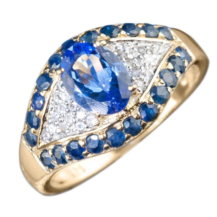 Nazar Ring crafted in sterling silver with gold plating, featuring a pear-shaped blue gemstone surrounded by smaller blue and clear stones, designed for women’s jewelry.
