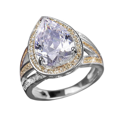 Charisma Ring featuring a two-tone sterling silver band with a large pear-shaped central gemstone surrounded by smaller accent stones, designed for female jewelry enthusiasts.
