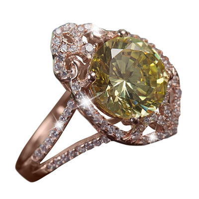 Ultra Verde Ring featuring a large green gemstone centerpiece set in sterling silver with rose gold plating, accented by intricate sparkling details, designed for women’s jewelry.