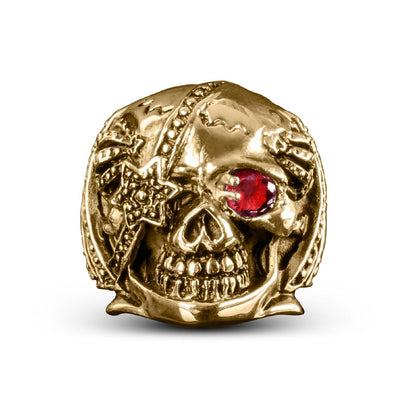 Riotous Skull Ring in gold plated stainless steel featuring a detailed skull design with a red gemstone eye, perfect bold jewelry for men.