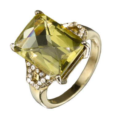Orchard Ring featuring a large rectangular yellow gemstone set in gold-plated sterling silver with sparkling accent stones, designed for female jewelry collectors.
