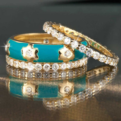 St. Tropez Stacker Rings featuring sterling silver with one band enameled in turquoise and two bands adorned with sparkling clear stones, designed for female jewelry layering.