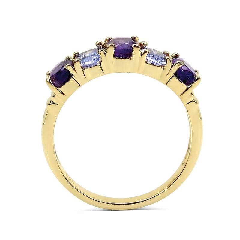 Dafina Tanzanite Ring featuring sterling silver band plated in gold with alternating purple and light blue tanzanite gemstones, designed for women’s elegant jewelry collection.