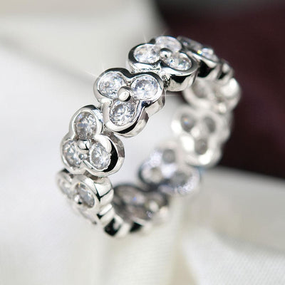 Vienna Eternity Ring crafted in sterling silver with rhodium plating, featuring a continuous floral-inspired design set with clear sparkling stones for elegant female jewelry.