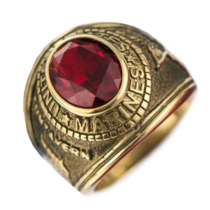 Marines' Ring crafted from gold-plated stainless steel featuring a bold red gemstone centerpiece, detailed with intricate United States Marines engravings.