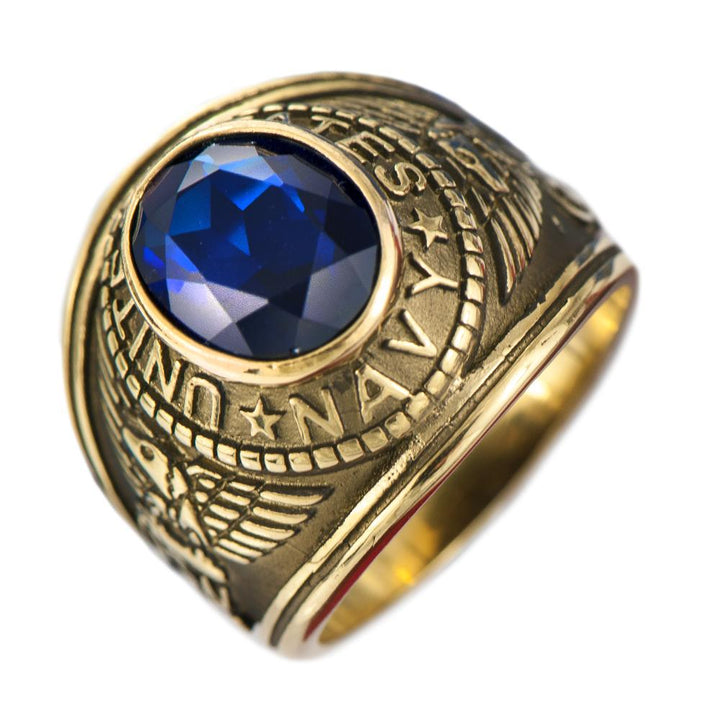 Navy Ring featuring a gold-plated stainless steel band with detailed naval insignia and a large faceted blue stone centerpiece, designed for men’s jewelry.