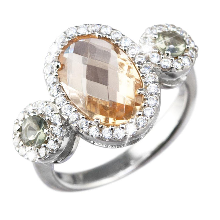 Vernaison Champagne Ring featuring a sterling silver band with a large faceted champagne gemstone center and two smaller round stones, all surrounded by sparkling accents.